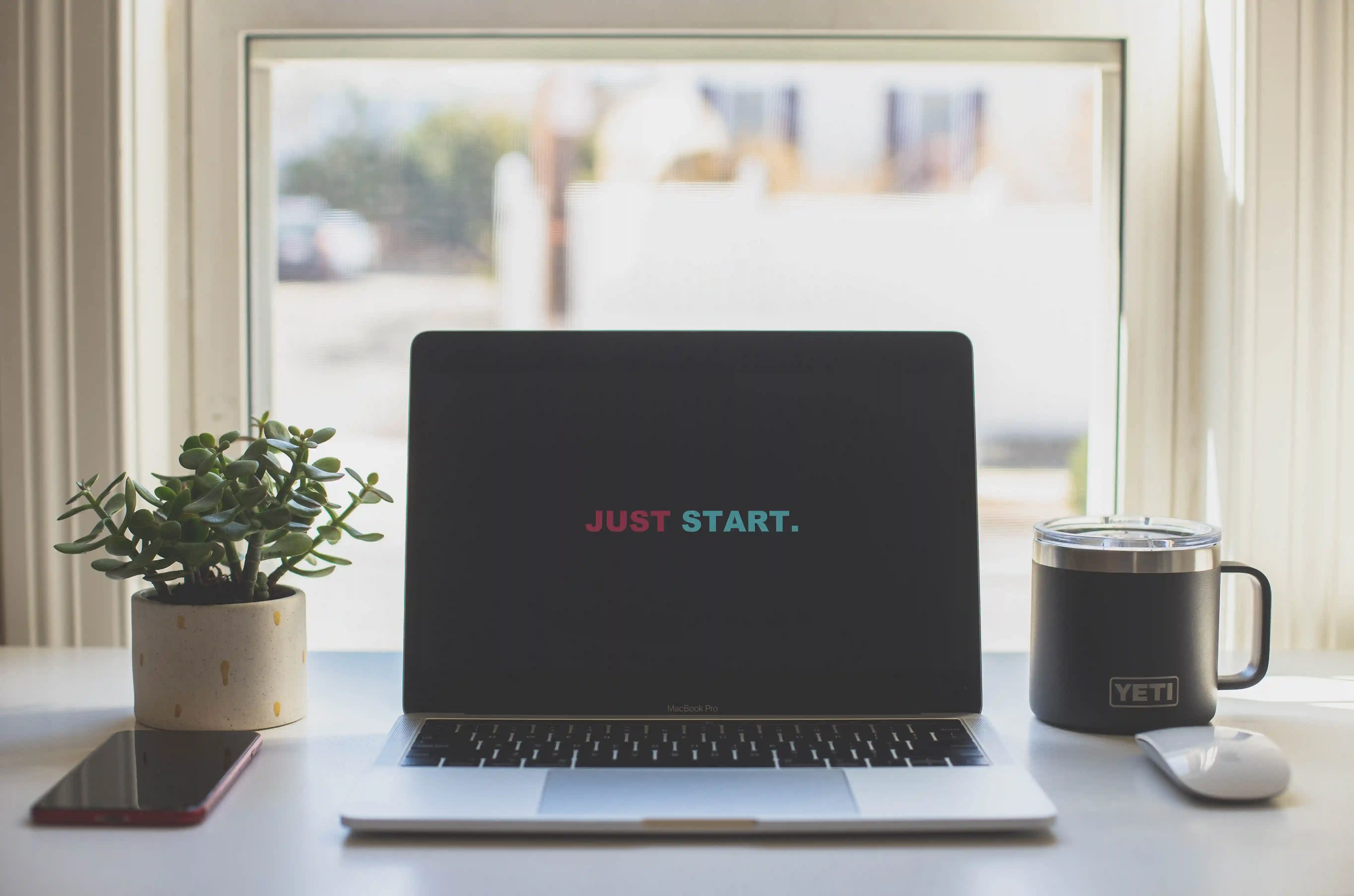 Just start is written on a laptop screen